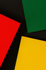 Abstract geometric black, red, yellow, green color background. Black History Month background with copy space for text