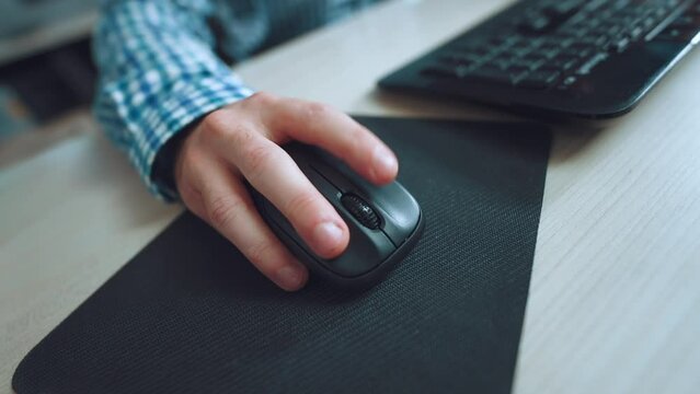 Computer mouse click, close-up of a computer mouse