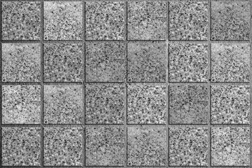 Obraz premium Concrete gray tiles with the texture of fine crushed stone. Stone and cement background.