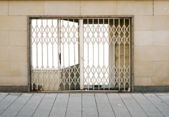 closed shop in the urban city with metal grid door