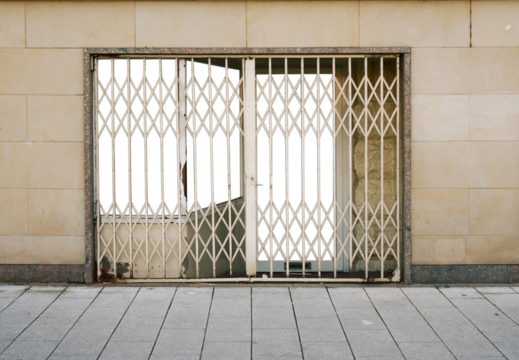 closed shop in the urban city with metal grid door
