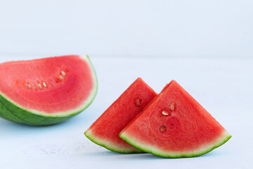slice of fresh watermelon on white background. slices of red watermelon with copy space on the...