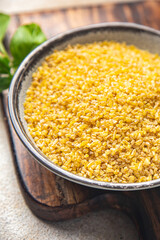 bulgur raw grain crop plant-based food healthy meal food snack diet on the table copy space food background rustic top view keto or paleo diet veggie vegan or vegetarian food