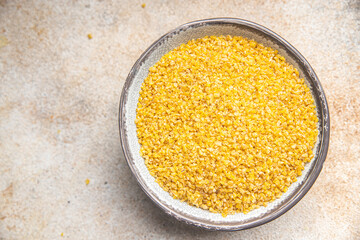 bulgur raw grain crop plant-based food healthy meal food snack diet on the table copy space food background rustic top view keto or paleo diet veggie vegan or vegetarian food