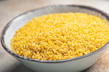bulgur raw grain crop plant-based food healthy meal food snack diet on the table copy space food background rustic top view keto or paleo diet veggie vegan or vegetarian food