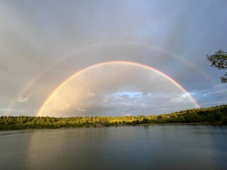 Fototapeta na wymiar rainbow over the lake
