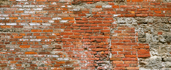 Old crumbling brick wall, detail.
