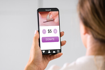 Woman Using Online Money Donation Mobile Phone