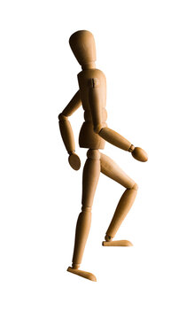 Wooden mannequin walking or climbing up the stairs