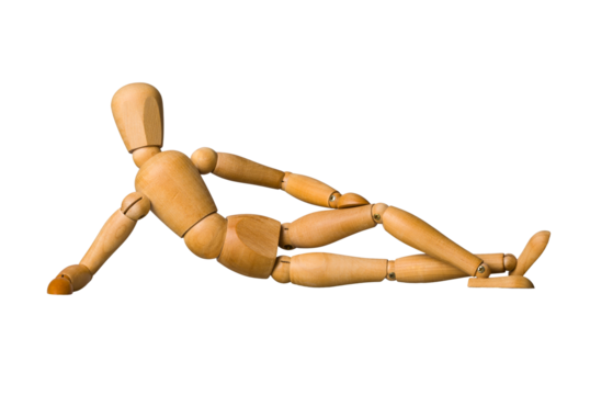 Wooden mannequin lying down on a side