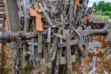 Hill of Crosses in Lithuania. Many wooden crosses.