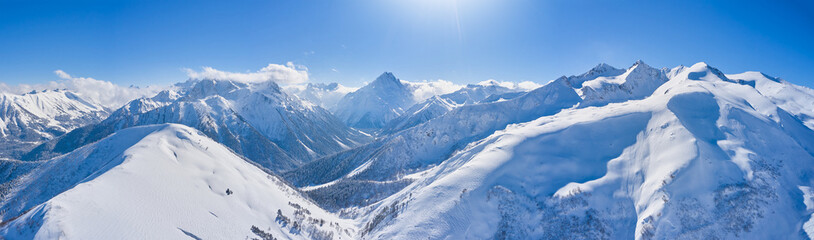 Panorame of winter landscape in mountains at sunny day