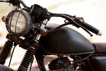 Closeup of vintage black custom motorcycle, selective focus 