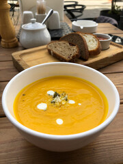 pumpkin soup on a table in street cafe