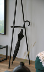 Modern Black umbrella holder with black umbrella inside