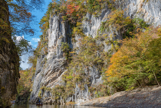 Geibikei Gorge River Cruises in Autumn foliage season. Beautiful scenery landscapes view in sunny weather day. Ichinoseki, Iwate Prefecture, Japan