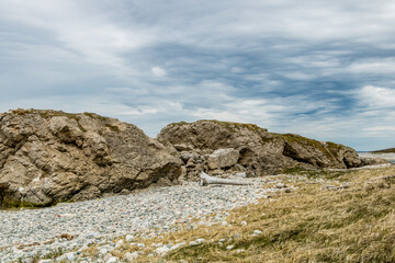 Fototapeta premium Sea stacks and caves at low tide. Arches Provincial Park, Newfoundland, Canada