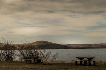 Fototapeta na wymiar Mid Spring day by the lake. Travers Dam PRA, Vulcan County, Alberta
