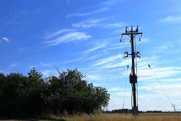 Electrical end pole at a field. Power distribution. Nature and summer. Skara, Sweden.