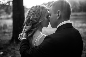 Young couple enjoying romantic moments while walking in the park.  Romantic Married young family.