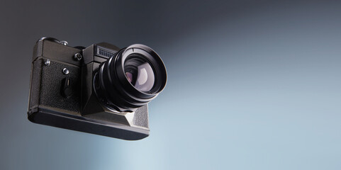 Vintage old SLR 35 mm film camera with copy space