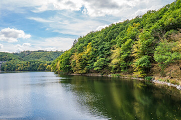 Fototapeta na wymiar Lake Rursee, In the middle of the Eifel National Park, surrounded by unique natural scenery and unspoilt nature