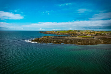 Obraz premium Irish seascape near St Cwyfan Church in the sea, Anglesey, Wales. 