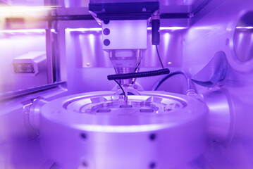 Cad cam milling machine in dental laboratory. Production of high esthetic dental crowns and dentures.