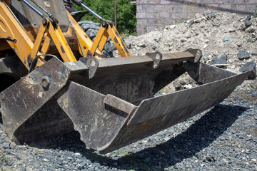 Modern excavator running on the road