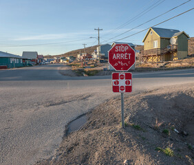 Four way stop sign written in English, French and Inuktitut in Iqaluit, Nunavut 