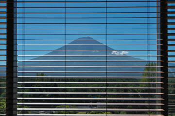 Yamanashi,Japan - September 16, 2022: Mt. Fuji viewed through window shade
