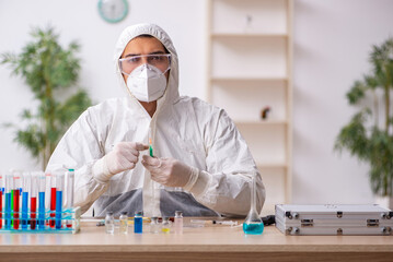 Young male chemist in vaccination concept during pandemic