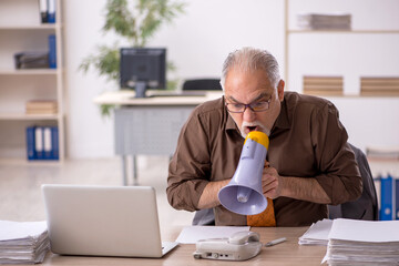 Fototapeta premium Angry boss employee holding megaphone at workplace