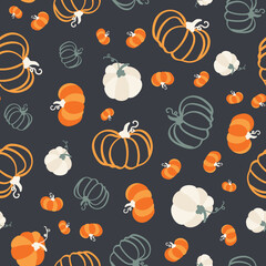 Seamless pattern of colorful hand drawn pumpkins on dark background. Cute surface design. Playful graphic flat illustration for seasonal fall, autumn and Halloween holiday