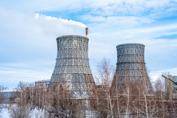 Gas combined heat and power plant with huge pipes, smoke, steam, power stations.