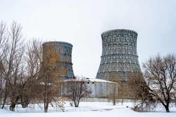 Gas combined heat and power plant with huge pipes, smoke, steam, power stations.