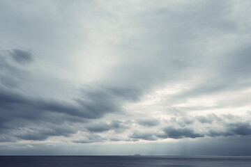 Naklejka na ściany i meble dark blue sea background, moody sky