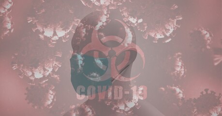 Hazard sign and Covid-19 text and cells against 3D human head model wearing face mask