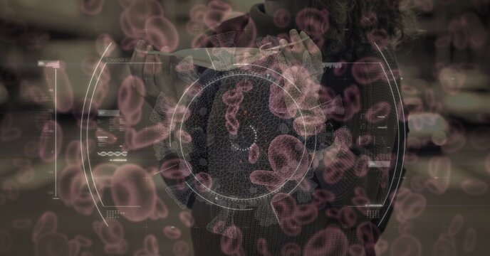 Covid-19 cells against woman wearing face mask using smartphone