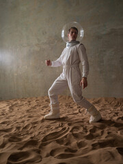 Heroic astronaut in a retrofuturism-style spacesuit on a desert planet, discoverers of new worlds,...