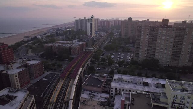 Aerial view on New York subway line in Brooklyn. Subway train  is going on rail track in the city.