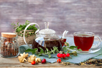 Hot tea with rose hips and herbs in a glass bowl. Drink containing vitamin C and antioxidants.