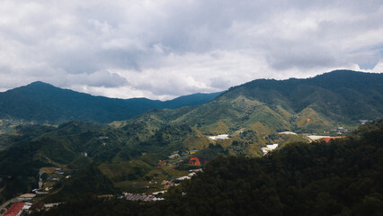 Fototapeta na wymiar Mountain valley in contrasting morning light in Cameron Highlands.