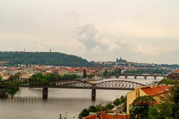 Fototapeta na wymiar Vltava River in Prague, Czech Republic, viewed from the Vysehrad fort on a cloudy day. - stock photo