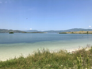 A pond with clear transparent water. Mountain Lake. Lake Sevan in Armenia.