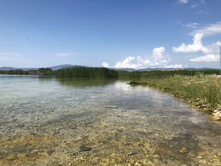 A pond with clear transparent water. Mountain Lake. Lake Sevan in Armenia.