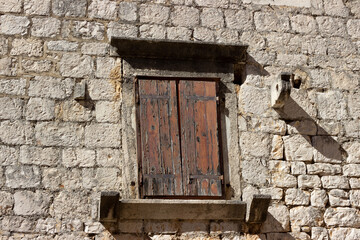 Old Mediterranean wooden windows weathered by the sea
