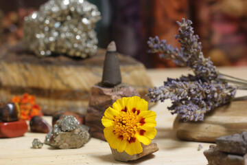 Obraz na płótnie Canvas Incense Cone on Stone With Crystals and Flowers. Meditation Table