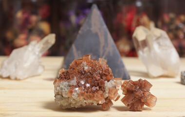 Aragonite Carbonate Crystals With Pyramid in Background