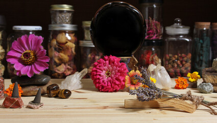 Meditation Altar With Rock Crystals and Flowers. Jars of Herbs in Background